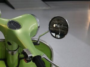 DC3 reflected in scooter wing mirror