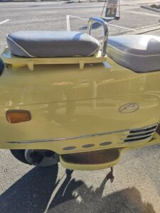 Side of a Fuji Rabbit Motor Scooter