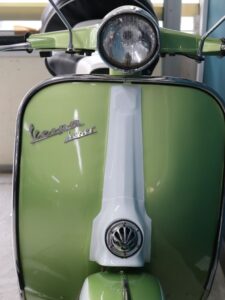 Front view of Forfar Road's mint green Vespa